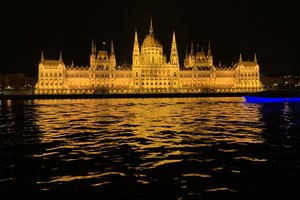 A large building with lights on the side of it.