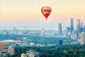 A hot air balloon flying over a city.