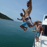 Show thumbnail preview	 Three men jumping off a boat into the sea.