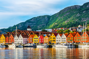 Colorful houses and boats on the water in bergen, norway.